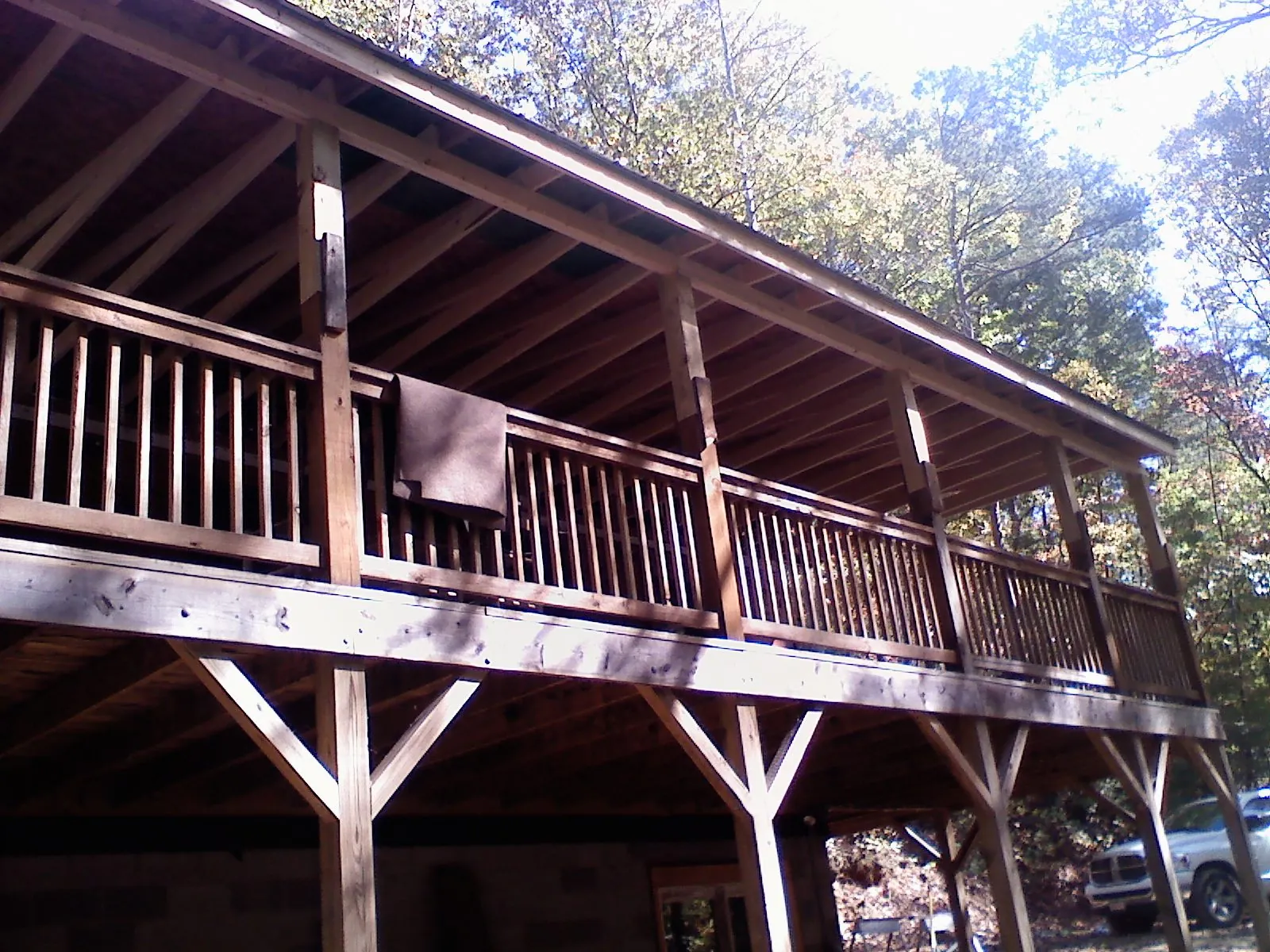 Timber framing under a new elevated porch and deck — Roof Leak Repair in Pointblank by Roofing Brothers